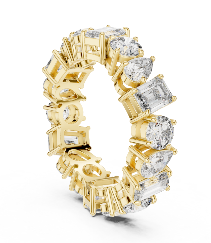 Mixed Cut Diamond Eternity Band Ring in 18K Yellow Gold, featuring an elegant mix of diamond cuts — round, cushion, emerald, radiant, and pear — encircling a luminous golden band.