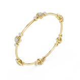 Yellow gold diamond floral knot bangle side view diamond bracelet