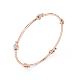 Yellow gold open knot diamond bangle side view diamond bracelet