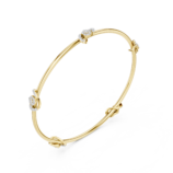 Yellow gold open knot diamond bangle side view diamond bracelet