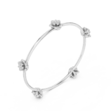 White gold floral knot diamond bangle side view luxury bracelet