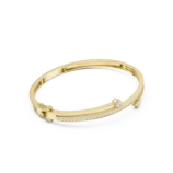 Yellow gold wavy three stone diamond bangle side view diamond bracelet